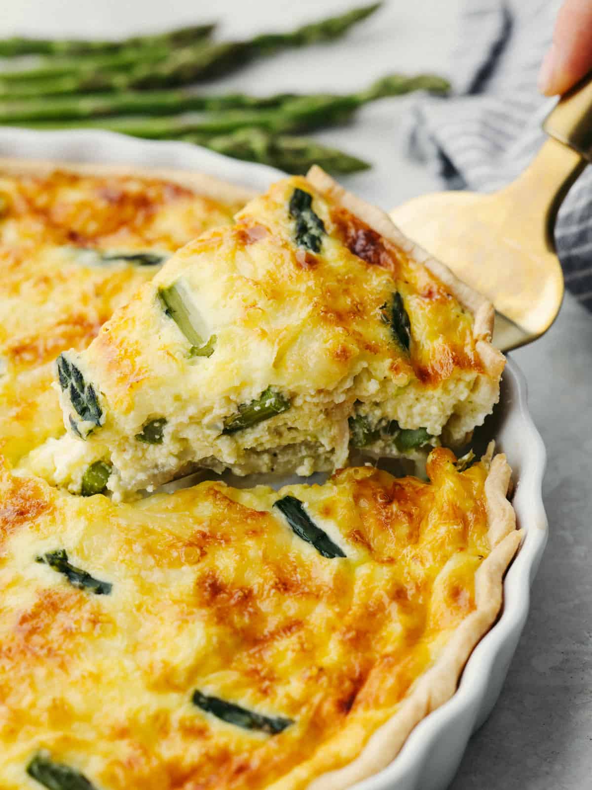 Asparagus Quiche served with a side salad and roasted potatoes.