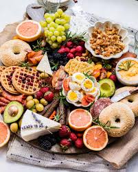 Deluxe Breakfast Charcuterie Board with Fresh Fruits, Pastries, and Cheese