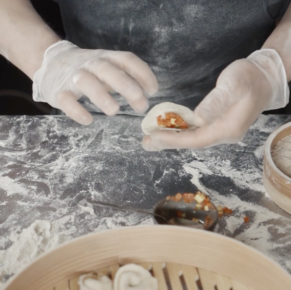 Steamed Handmade Asian Dumplings with Savory Pork Filling