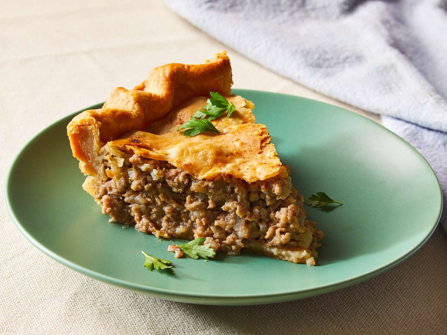 Slice of traditional tourtière meat pie